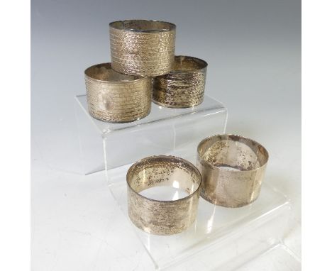 A set of three George VI silver Napkin Rings, by&nbsp;E J Houlston., hallmarked Birmingham, 1943, with engine turned decorati