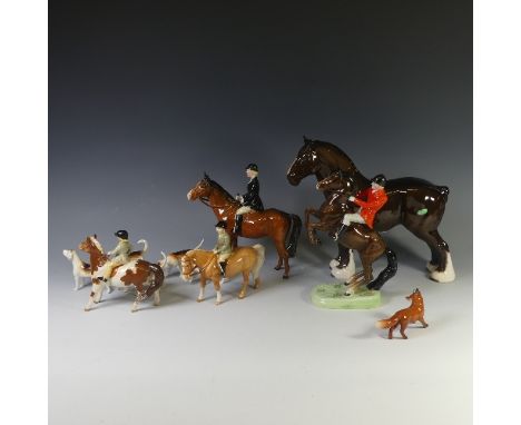 A Beswick pottery Hunting Group, to include four Riders, one on Rearing Horse, one with Black Coat, two with Green Coats, fiv