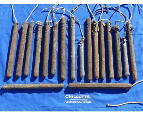 Fourteen early 19thC sash window Weights, stamped 7½, 9, 9½ etc., L 46cm (14) 