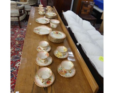 A Nautilus Scottish porcelain floral Tea Service, comprising of eleven Cups, twelve Saucers, two Cake Plates, twelve Tea Plat