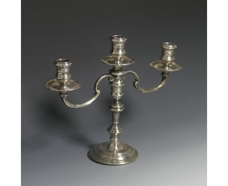 An Elizabeth II silver three light candelabrum, by&nbsp;William Comyns &amp; Sons Ltd., the stick hallmarked London 1959, the