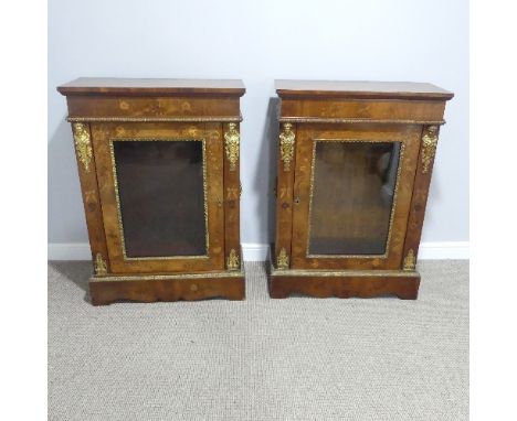 A pair of Victorian walnut and marquetry inlaid Pier Cabinets, with glazed door opening to reveal a single shelf, flanked by 