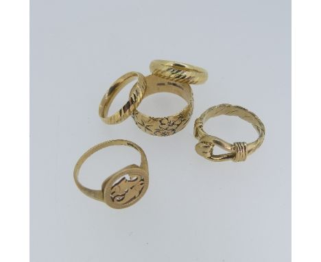 Two 9ct yellow gold textured Bands, one Size R, one N, together with a wide 9ct gold band with foliate decoration, Size U, a 