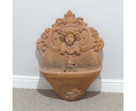 Garden Statuary; a vintage terracotta wall Fountain, moulded in relief with a classical bust, the mouth plumbed for water, 54