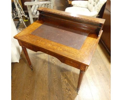 An Edwardian inlaid mahogany Bureau de dame, with gallery back, brown leather skiver and inlaid foliate decoration, above thr