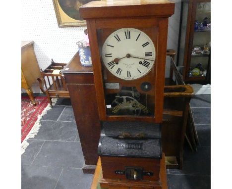 An early 20thC oak cased Clocking-in Machine, by the National Time Recorder Ltd, the Roman numeral dial inscribed St Mary Cra
