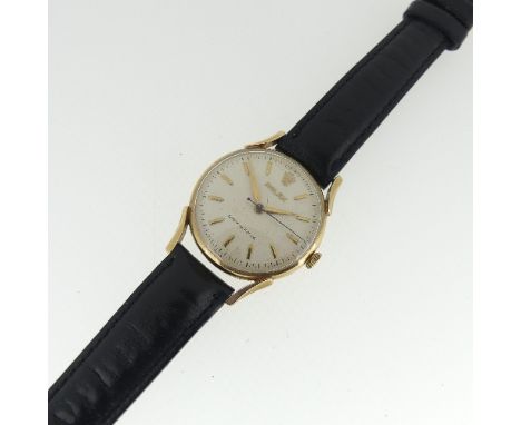 A vintage 9ct gold Rolex gentleman's Wristwatch, the champagne dial with gilt baton markers and Rolex emblem at 12, marked Sh