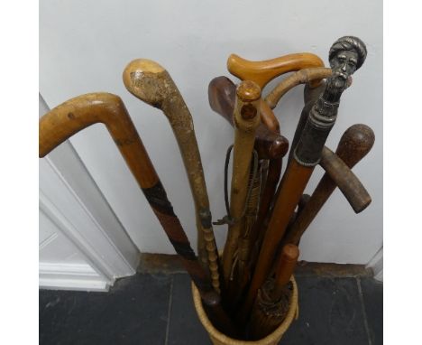 A vintage white metal mounted hardwood Walking Stick, the top modelled as a Turkish Gentleman in turban, 94cm, together with 