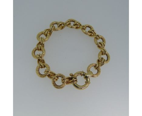 A 9ct yellow gold hollow link Bracelet, formed of textured circular links joined by smaller polished twisted links, with larg