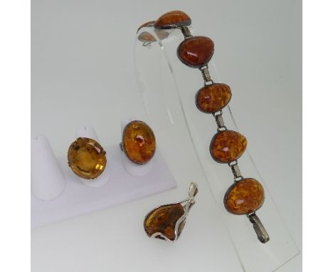 A large citrine Dress Ring, the oval facetted stone approx 26mm long, mounted in 9ct gold Size N, total weight 13.7g, togethe