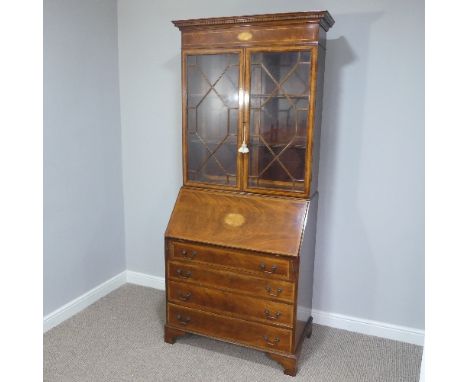 An Edwardian mahogany inlaid Bureau Bookcase, with astragal glazed upper section enclosing two shelves, the fall front with f