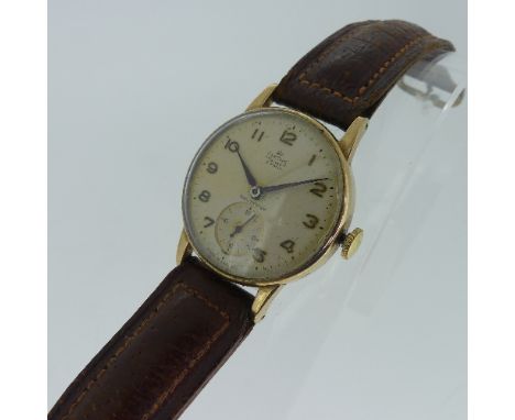 A vintage Smiths Deluxe 9ct gold gentleman's Wristwatch, with 15-jewels movement, the circular dial with raised Arabic numera