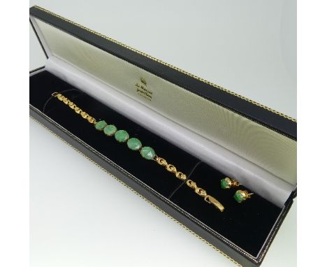 A 14ct gold and jade Bracelet, the front with five oval jades, marked on the clasp 585 and tested, 16cm long, approx total we