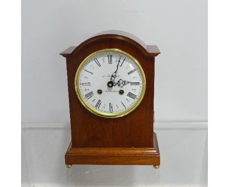 A modern Mantel Clock in the antique style, the white enamelled Roman dial marked 'J Guilsborough, Northampton', with German 