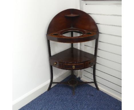 A Georgian mahogany corner Washstand, with one drawer and two dummy drawers, raised on splayed legs, some damage to veneer, W