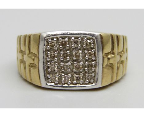 A 9ct gold ring set with diamonds, 8.1g, R, 0.25 carat diamond weight