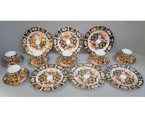 A Royal Crown Derby 2451 pattern six setting coffee set; six cans, saucers and tea plates