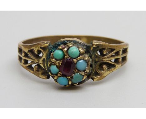 A Victorian turquoise and ruby cluster ring, marked 15C, 2.1g, N