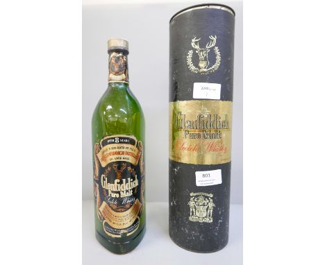 A one litre bottle of vintage Glenfiddich pure malt scotch whisky with tin 