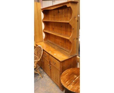 Large pine Welsh dresser with three shelf back and three drawers over three cupboards 