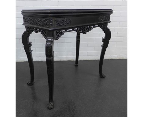 Ebonised chinoiserie style card table with blind fret carved frieze and stylised cabriole legs, the top opening to reveal red