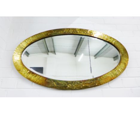 Arts &amp; Crafts brass framed wall mirror with Celtic knot work pattern and oval bevelled plate, 52 x 95cm 