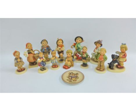 A collection of thirteen Hummel &amp; Goebels figures, etc, tallest 13cm, (13)