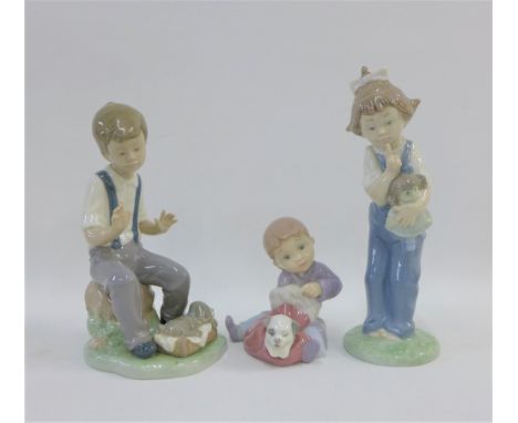 Three Nao porcelain figures of children, tallest 19cm (3)