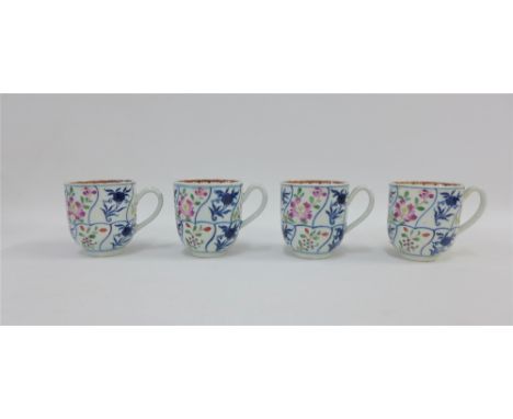 Set of four 18th century Worcester type blue and white coffee cups with polychrome enamelled floral sprays, one cup with rest