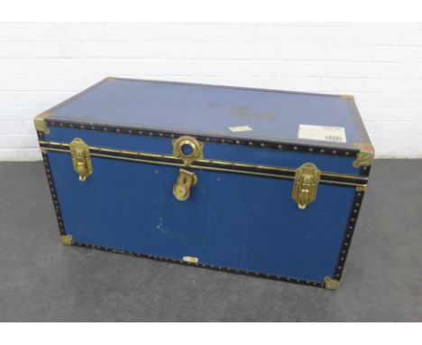 Blue and brass mounted travel trunk, with labels 50 x 100cm 
