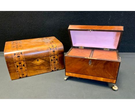 A 19th century crossbanded mahogany tea caddy, ebony line detailing, two section lidded interior, brass ball and claw feet, l