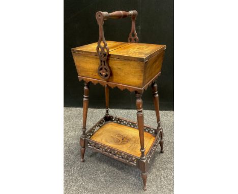 An Edwardian walnut work-box, pair of inlaid lift-up doors to top enclosing a lined interior, carrying handle to top, turned 