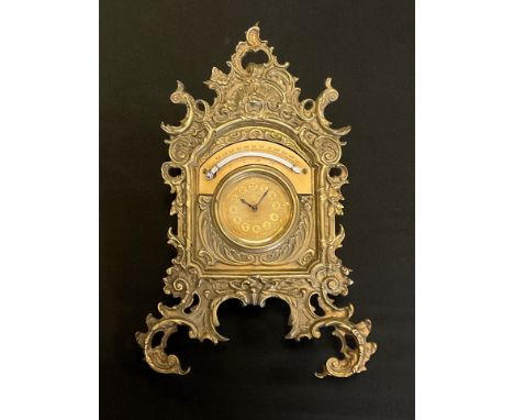 A brass strut clock timepiece and thermometer, by The British United Clock Company, Birmingham, 27cm high 