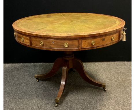 A Regency style 20th century mahogany drum table, with four frieze drawers and four dummy drawers, brass ring handles, green 