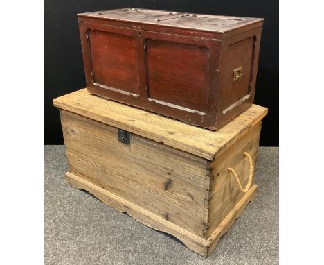A large pine steamer trunk, hinged lid, rope handles, shaped base, 58.5cm high, 104cm wide, 60cm wide;  a small oak blanket b