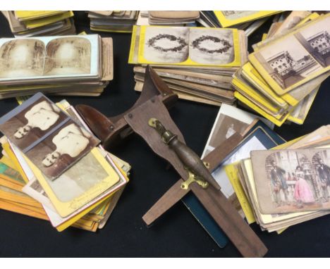 A handheld stereoscope viewer and over 500 stereoscopic cards, inc Children at Play, Topographical scenes, Architectural , Ri