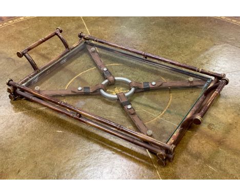 An unusual Jacques Adnet style Equestrian faux bamboo and glass rectangular serving tray, leather effect strap and ring cross