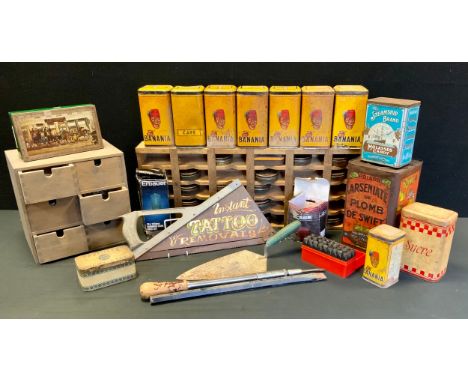 Advertisement and tools; various tins including banania, molasses candy, polish rack, a ‘instant tattoo removal” advertising 