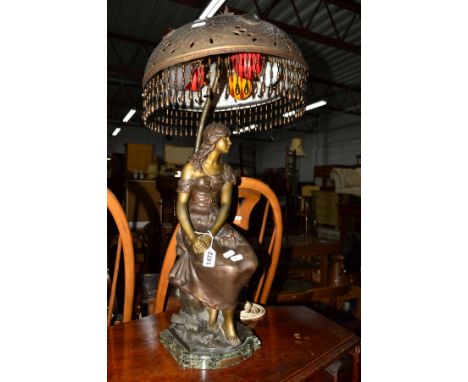 AUGUSTE MOREAU, MIGNON, a French spelter figural table lamp of a seated woman on a green veined marble base, with a metal sha