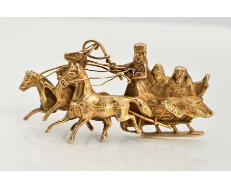 A BROOCH, depicting three horses pulling a sledge containing three gentleman in Russian winter attire, believed to be silver 