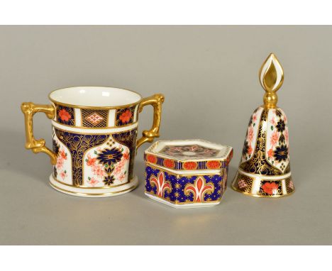 THREE PIECES ROYAL CROWN DERBY, to include '1128' pattern loving cup, height 8cm and bell shaped trinket, height 12cm and a A