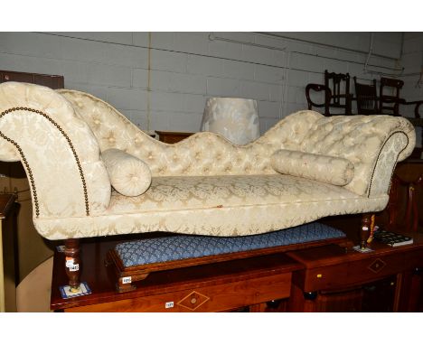 A CREAM FLORAL UPHOLSTERED SCROLLED TWO SEATER SOFA, width 197cm