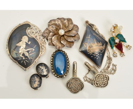 A SELECTION OF SILVER AND WHITE METAL JEWELLERY, to include a Siam pendant, brooch and pair of clip earrings, a pair of Celti