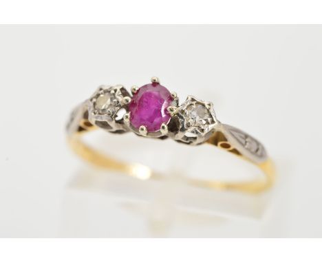 AN 18CT GOLD RUBY AND DIAMOND RING, the central claw set circular ruby flanked by illusion set single cut diamonds, estimated