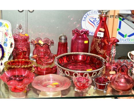 A COLLECTION OF CRANBERRY/RUBY GLASS, to include decanter, plated epergne stand with flute, jug, bell, salts, vases, bowl etc