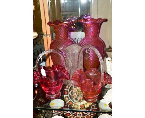 FOUR PIECES OF CRANBERRY GLASS, to include two baskets, height 27cm, together with a cut glass lamp (5)