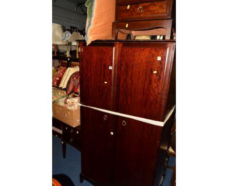 A STAG MINSTREL FIVE PIECE BEDROOM SUITE compromising double door wardrobe, dressing take with a triple mirror, stool and a p