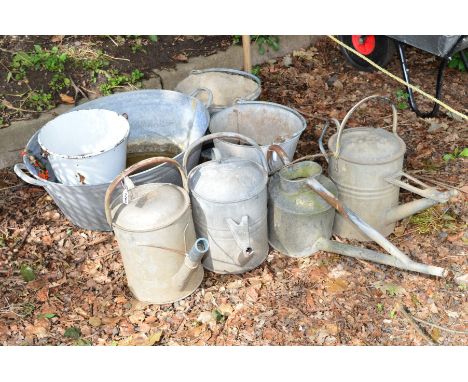 A COLLECTION OF GALVANISED ITEMS, to include three buckets, four watering cans and an enamel bucket (8)