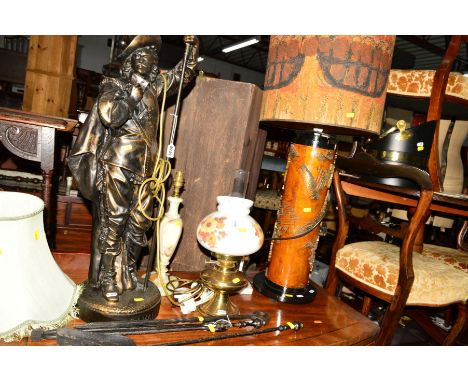 A DECORATIVE CYLINDRICAL TABLE LAMP with various decoration, together with a figural lamp (sd), electrical oil lamp, two othe