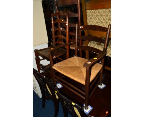 A GEORGIAN ELM LADDER BACK RUSH SEATED ELBOW CHAIR, together with an oak rush seater elbow chair and two other chairs (4)
